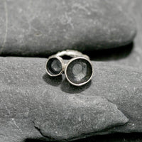 Handmade Sterling silver double acorn cup ring. The 2 acorn cups rest on a reticulated silver ring.