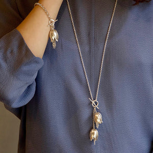 A hallmarked Sterling silver single fritillaria lily bracelet on a 7.5 inch Sterling silver belcher chain with a handmade catch. Statement floral jewellery by Sally Wilcox UK.