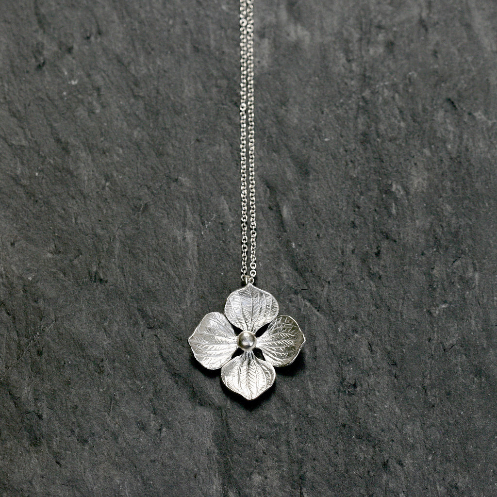 Hydrangea flower necklace in solid Sterling silver. It is also available in 22ct yellow gold vermeil plate. Hallmarked. All on an 18" silver chain. Floral jewellery, handmade in England.