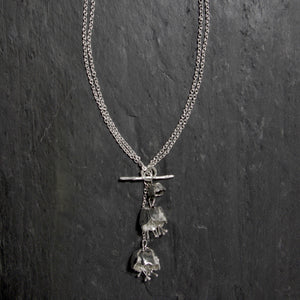 The Sterling silver Double Peony Flower Necklace is on a long 34 inch chain, with a T-bar at the front. it can be worn as a long necklace or doubled around to be worn as a stylish shorter necklace. 