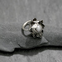 Hand carved Sterling silver rose ring with two layers of individually shaped rose petals, gently oxidised before a baroque pearl is carefully set and re-polished. Every piece is is a unique design. Floral jewellery handmade in England.