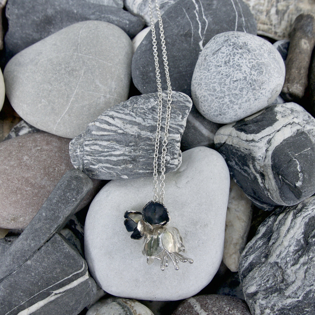 Floral Sterling silver hallmarked statement necklace on a long 34 inch chain with a Peony and 2 buttercups nestled next to each other. It is such a simple design that it can be worn with anything. Handmade in England.