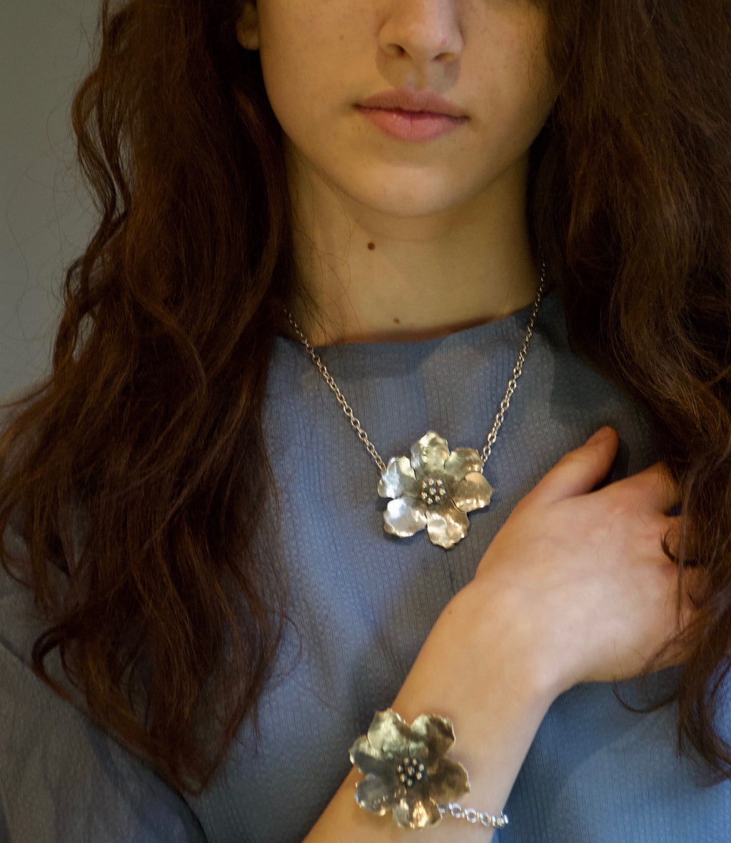 Large solid Sterling silver wild rose flower necklace on an 18 inch heavy 100 flat oval chain with a handmade hook catch. It's is carefully oxidised measures 5cm by 5cm and weighs 26 grams.