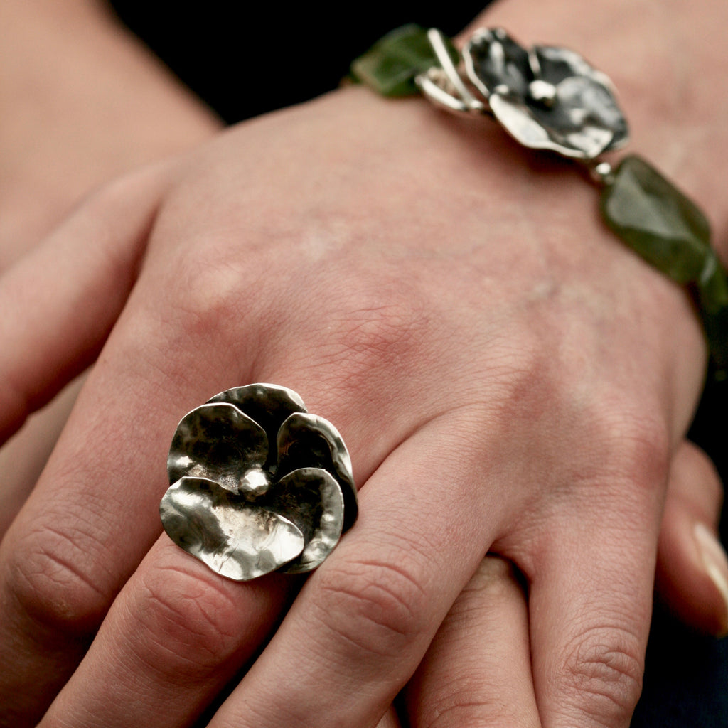 A Sterling silver hand carved pansy flower ring. Botanical jewellery handmade in England.