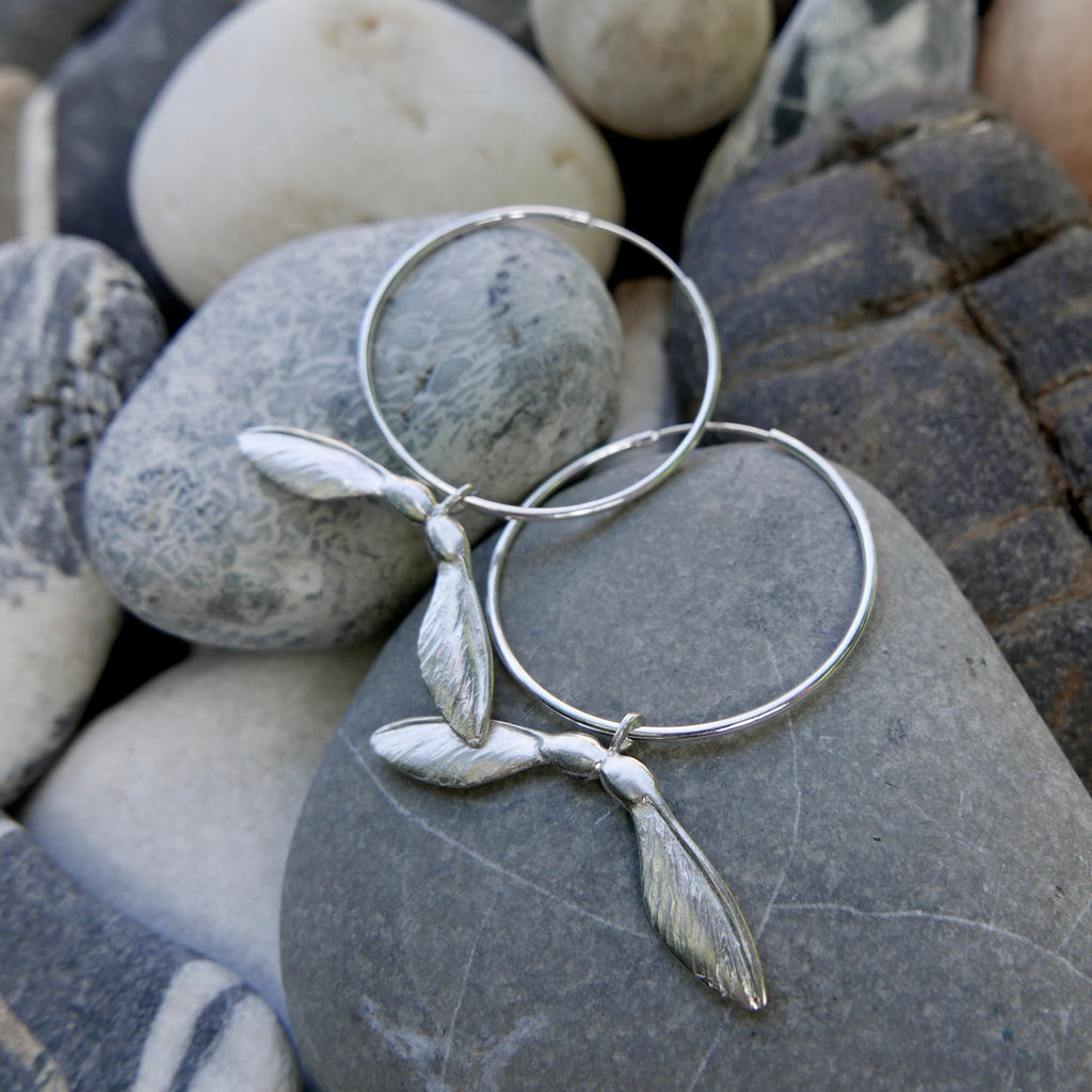 Sterling silver double sycamore key earrings measuring 2cm and hung onto a large hoop, they have lots of movement. Available in polished Sterling silver or vermeil plated 22ct yellow gold. Nature inspired jewellery, handmade in the UK.