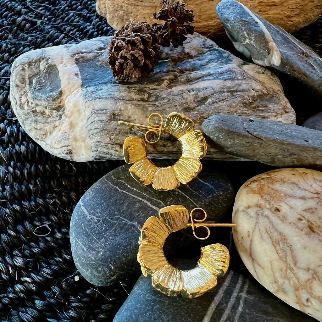 Handmade Sterling silver primrose petal garland hoop earrings on a stud post. Handmade botanical jewellery, made in England. Gold plated.